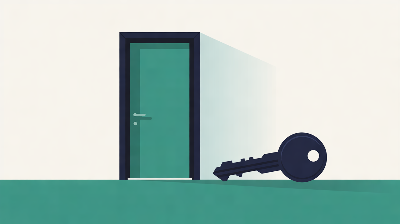 A closed teal door in a navy frame against an off-white wall, with a large navy key lying on the teal floor beside it